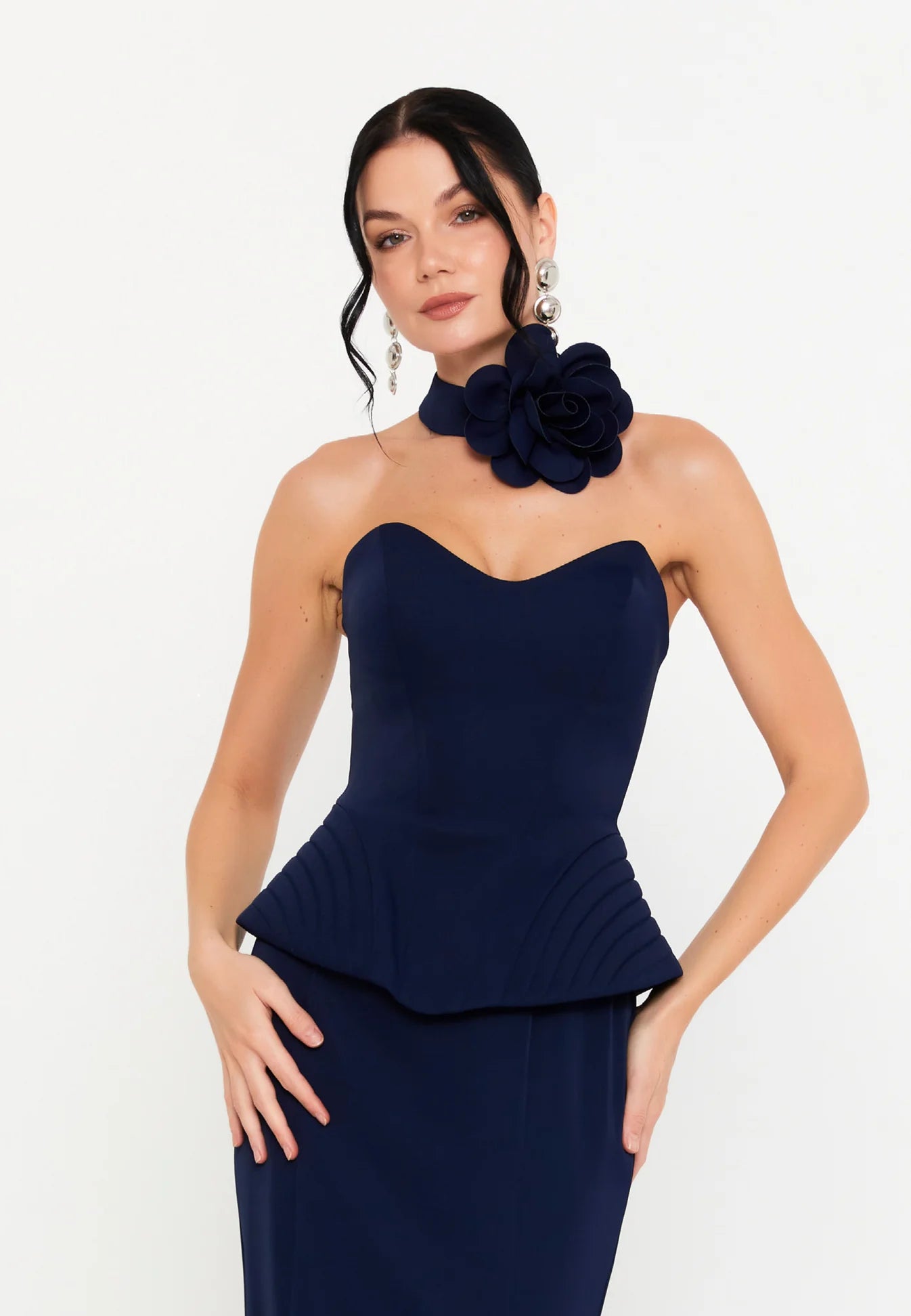 Long navy strapless evening dress with neck flower and waist ruffle